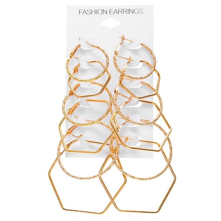 Boucles D'oreilles Dorées À Créoles Unies